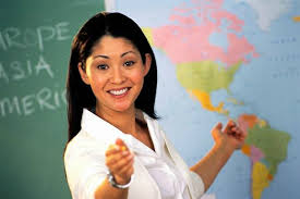 Lady teacher in front of map.